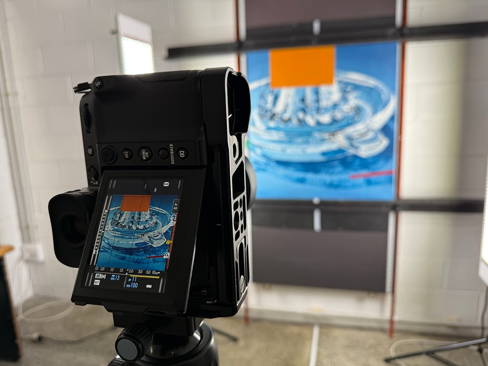 Painting being photographed for print